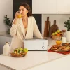 Imagen 4 Tostadora de ranura larga y 1000 W con capacidad para dos tostadas. Cuenta con soporte para panecillos, 7 niveles de potencia y función descongelar.