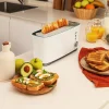 Imagen 5 Tostadora de ranura larga y 1000 W con capacidad para dos tostadas. Cuenta con soporte para panecillos, 7 niveles de potencia y función descongelar.