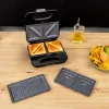 Imagen 5 Sandwichera 3 en 1 de 800 W con placas intercambiables. Tuesta sándwiches, gofres y grill. Revestimiento antiadherente RockStone y acabados en acero inoxidable.