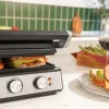 Imagen 8 Parrilla eléctrica Rock'nGrill Blaze de 2400 W con placas extraíbles RockStone, apertura 180º y control de temperatura y tiempo para un cocinado preciso.