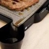 Imagen 6 Parrilla eléctrica de 1500 W con revestimiento RockStone antiadherente. Apertura de 180º, placa superior flotante y cajetín recogegrasas para cocina limpia.