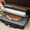 Imagen 7 Parrilla eléctrica de 1500 W con revestimiento RockStone antiadherente. Apertura de 180º, placa superior flotante y cajetín recogegrasas para cocina limpia.