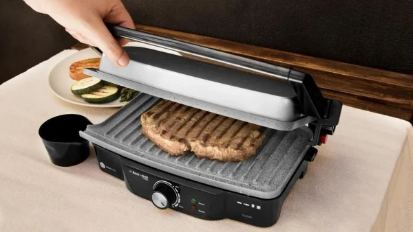 Imagen 7 Parrilla eléctrica de 1500 W con revestimiento RockStone antiadherente. Apertura de 180º, placa superior flotante y cajetín recogegrasas para cocina limpia.