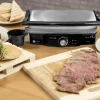 Imagen 8 Parrilla eléctrica de 1500 W con revestimiento RockStone antiadherente. Apertura de 180º, placa superior flotante y cajetín recogegrasas para cocina limpia.