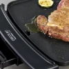 Imagen 5 Plancha de asar de gran potencia y revestimiento antiadherente Daikin. Cuenta con temperatura ajustable, bandeja recogegrasas y es apta para lavavajillas.