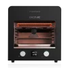 Vista frontal del horno asador Txuletaco 8000 Inferno de Cecotec mostrando su interior incandescente y accesorios