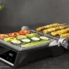 Imagen 3 Parrilla eléctrica 2000 W con sistema AutoCook, apertura 180º y placas extraíbles. Revestimiento RockStone antiadherente y control de temperatura automático.