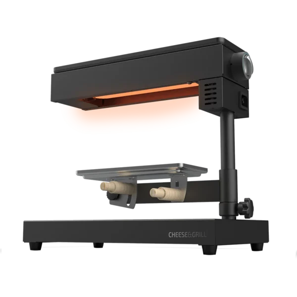 Imagen 2 Raclette Cheese&Grill 6000 Black de 600 W con función grill y acabados en acero inoxidable. Incluye parrilla antiadherente, termostato regulable y espátulas.