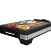 Imagen 2 Plancha eléctrica de 2000 W con acabados inox y superficie mixta. Revestimiento RockStone antiadherente y termostato regulable para una cocina precisa.