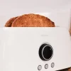 Imagen 5 Tostadora digital beige de 1500 W con 2 ranuras largas extraanchas para 4 tostadas. Incluye soporte para panecillos, 3 funciones, luz LED y control de tiempo.