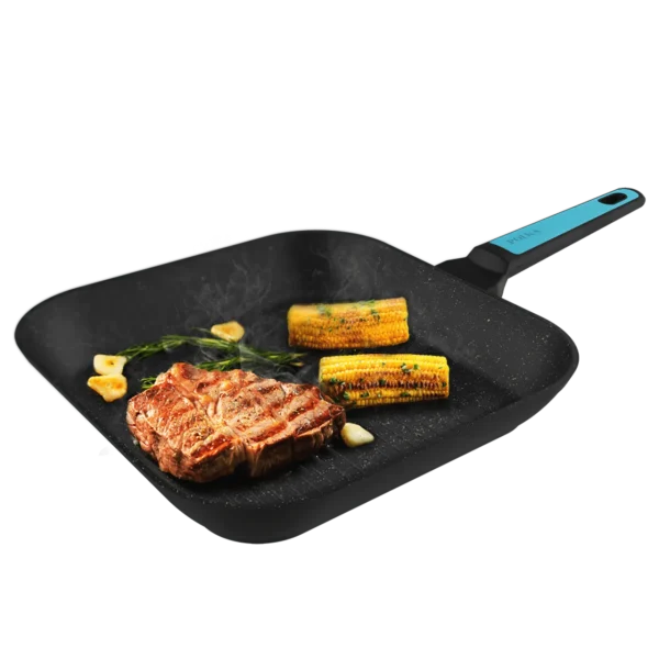 Vista frontal del grill Polka Platinum 28 Grill Thunder de Cecotec con superficie ondulada y revestimiento antiadherente