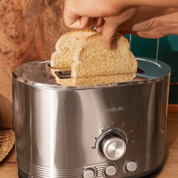 Imagen 5 Tostadora de doble ranura con 850 W y acabado en acero inoxidable. Cuenta con ranuras extraanchas de 3,8 cm, varillas superiores y sistema de autocentrado.