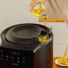 Imagen 5 Freidora de aire Cecofry Rain Pack de 5,5 L con spray de aceite automático y 1550 W. Cocina sana con autolimpieza, 8 menús y accesorios de silicona.