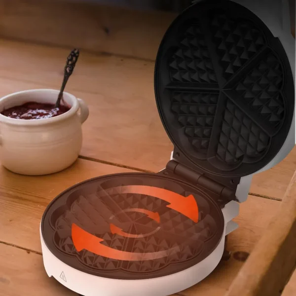 Imagen 6 Gofrera circular de 1000 W con revestimiento RockStone antiadherente. Diseño en acero inoxidable para preparar un gofre grande o cinco con forma de corazón.