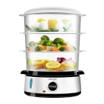 Vaporera eléctrica Cecotec Vapovita 3000 Inox con tres niveles de recipientes transparentes y base de acero inoxidable cocinando alimentos al vapor