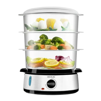 Vaporera eléctrica Cecotec Vapovita 3000 Inox con tres niveles de recipientes transparentes y base de acero inoxidable cocinando alimentos al vapor