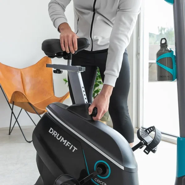Imagen 7 Bicicleta estática DrumFit Cycle 9000 Talos Pro con resistencia magnética motorizada, pulsómetro, sillín regulable y soporte. Ideal para entrenar en casa.