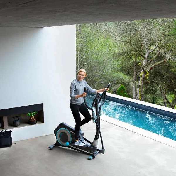 Imagen 3 Bicicleta elíptica DrumFit Elliptical 9000 Eir Pro con resistencia magnética regulable por motor, pantalla LCD, soporte para móvil y ruedas de transporte.