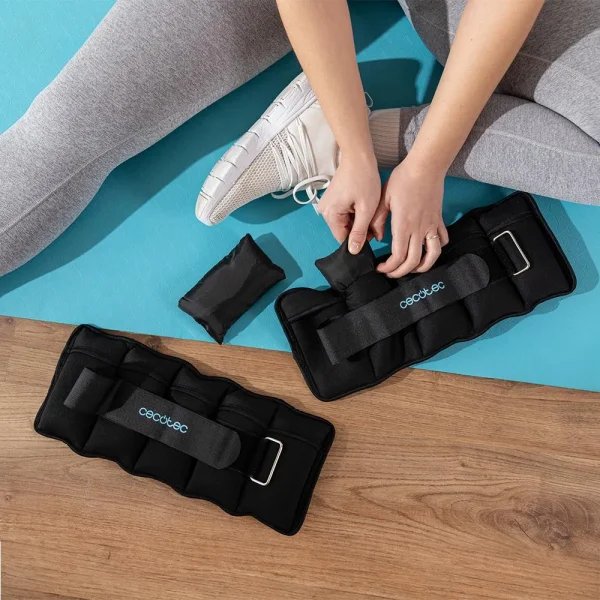 Imagen 4 Set de 2 pesas ajustables DrumFit AnkelBell 2500 Neo para tobillos y muñecas. Peso adaptable de 0,5 a 2,5 kg con sacos de arena y correas de velcro.