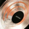Imagen 5 Calefactor exterior de 2100 W con resistencia de carbono. Cuenta con 3 niveles de potencia, altura ajustable y protección IP24 ideal para terrazas y jardines.
